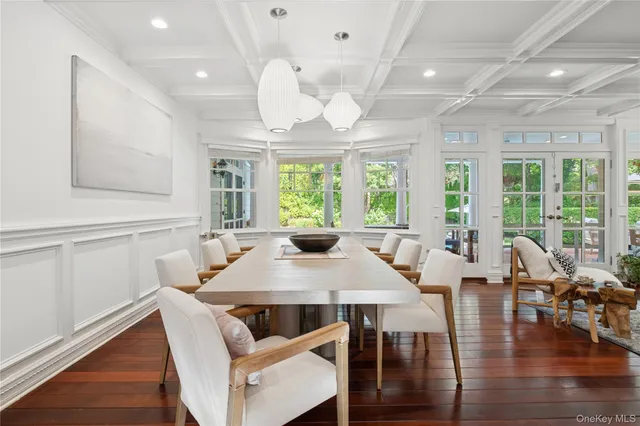 a living room with lots of furniture and wooden floor