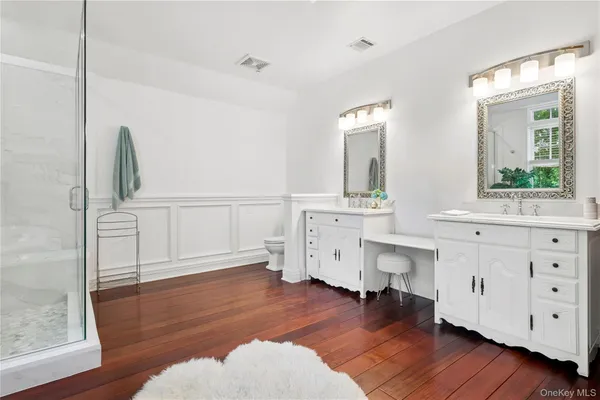 a view of cabinets and wooden floor