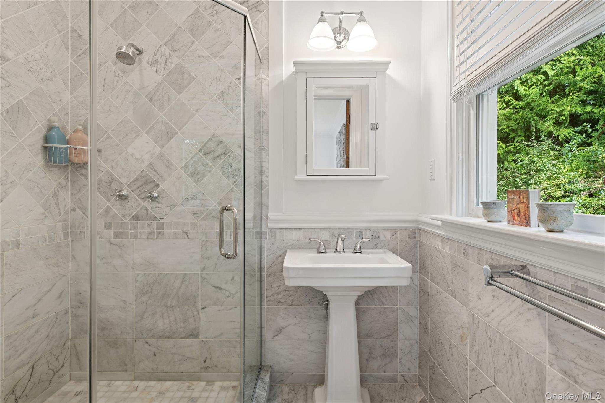 Undisclosed Address Remsenburg, NY 11960 - Photo 23 of 35 a bathroom with a sink a mirror and window