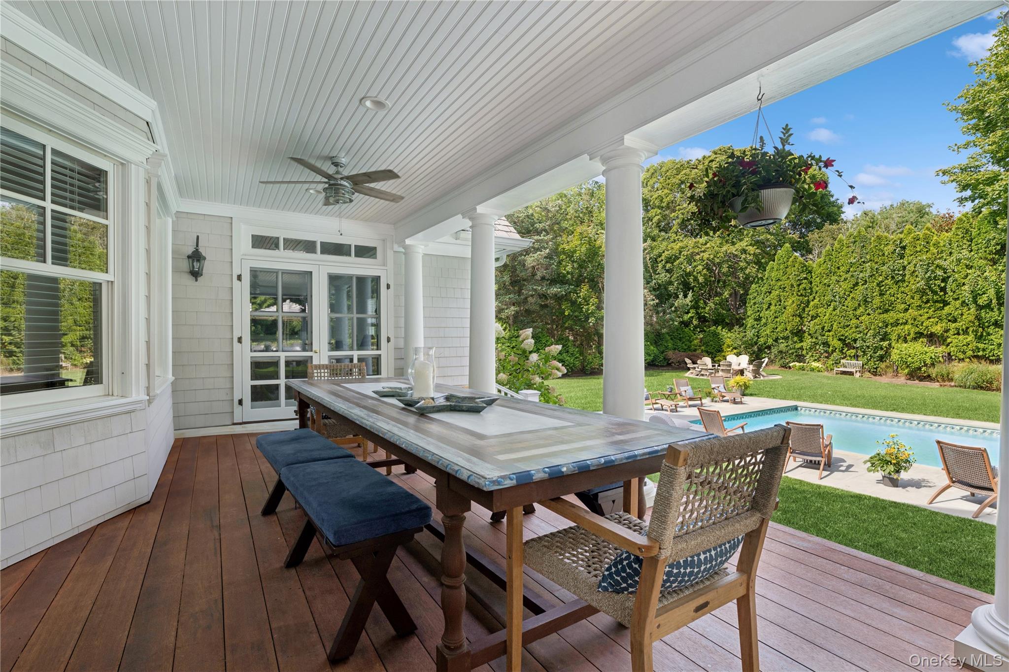 Undisclosed Address Remsenburg, NY 11960 - Photo 9 of 35 a view of a patio with a table chairs and a backyard
