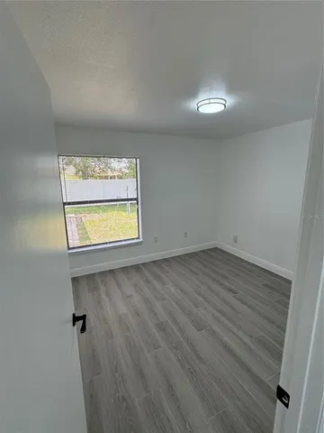 a bathroom with a sink mirror vanity and toilet