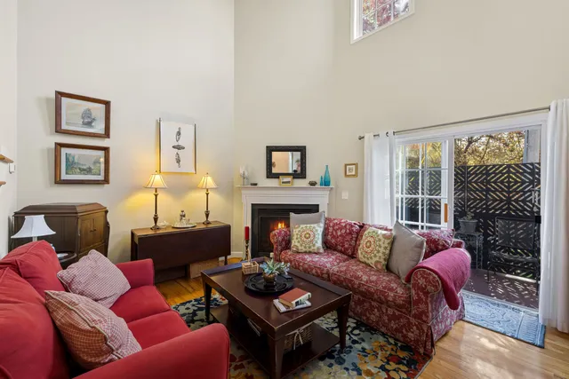 front view of a brick house with a chairs