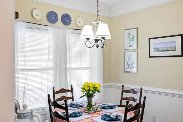 a living room with furniture or stairs and a wooden floor