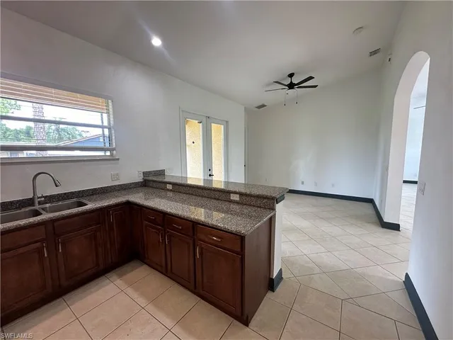 a kitchen with a sink and a refrigerator