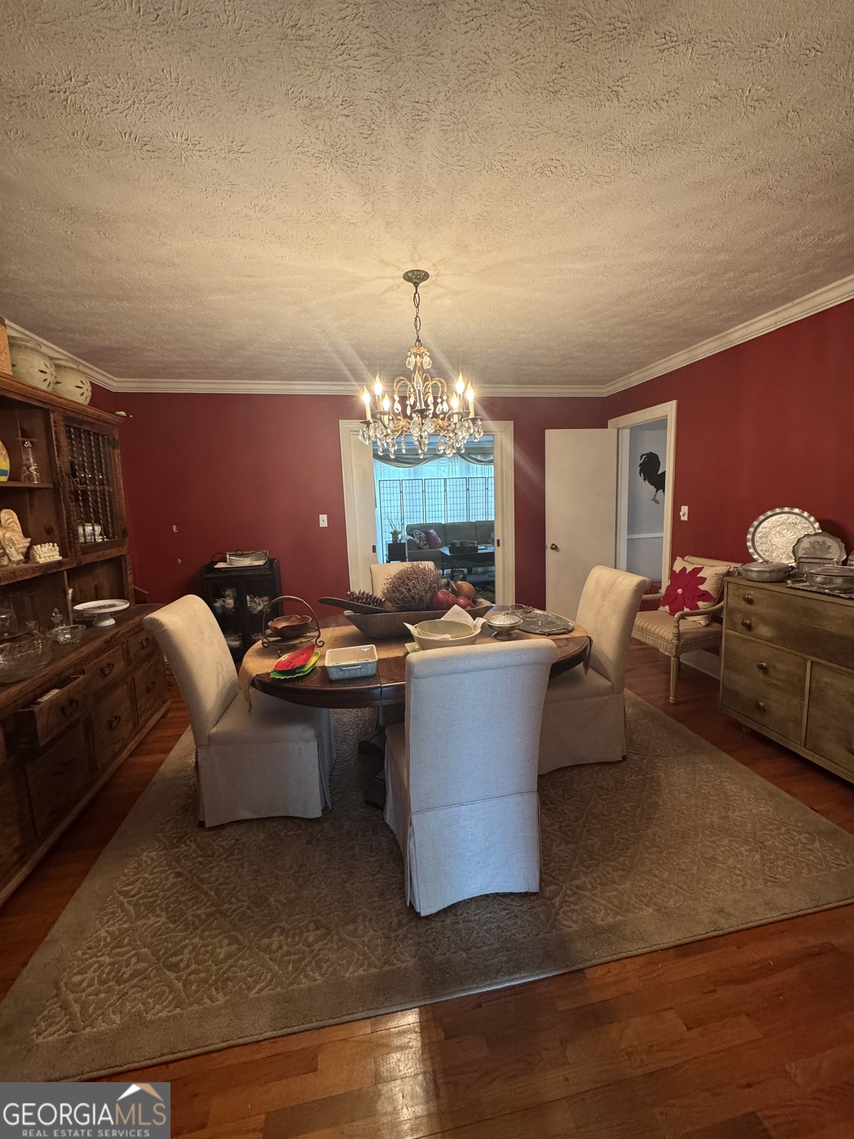 255 Highway 27 Georgetown, GA 39854 - Photo 15 of 16 a living room with furniture a chandelier and a dining table