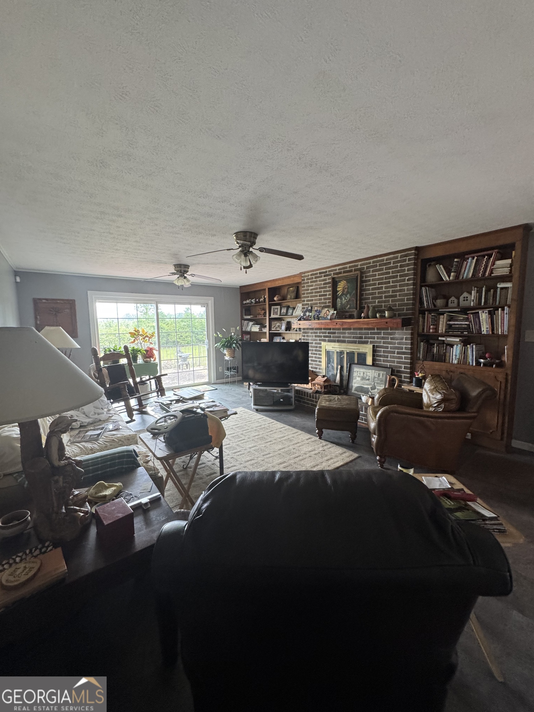 255 Highway 27 Georgetown, GA 39854 - Photo 3 of 16 a living room with lots of furniture and a large window