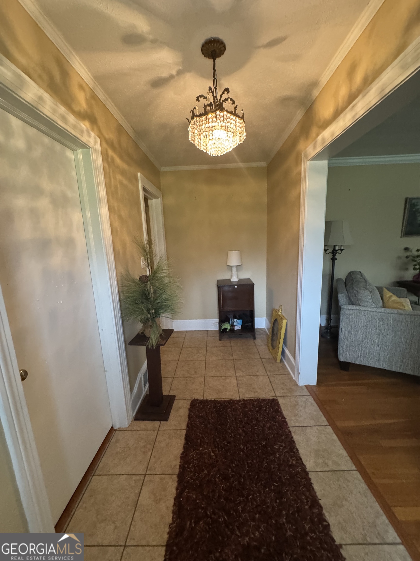 255 Highway 27 Georgetown, GA 39854 - Photo 8 of 16 a view of entryway with livingroom and chandelier