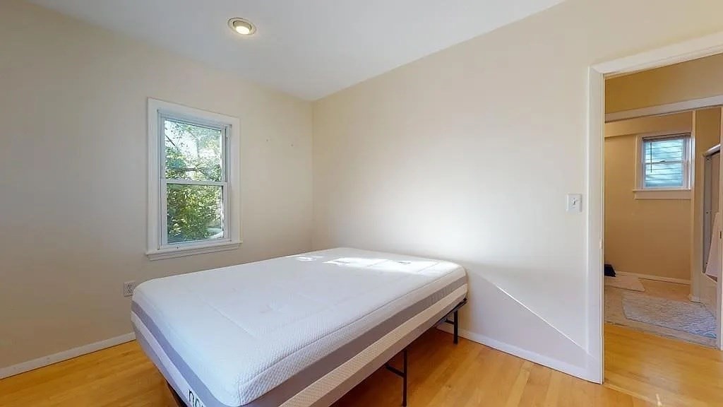 22 North Mead Street Boston, MA 02129 - Photo 4 of 7 a room with a bed and a window