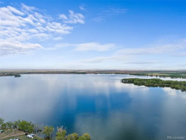 a view of lake with green space