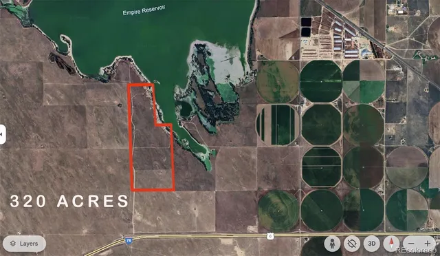 an aerial view of a house with backyard