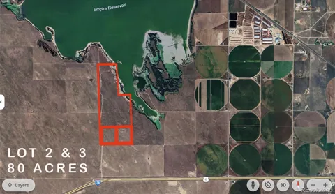 a view of a field with an ocean