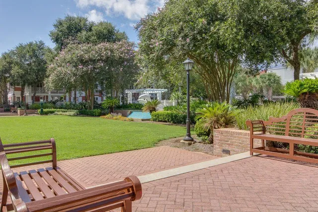 a view of a backyard with sitting area