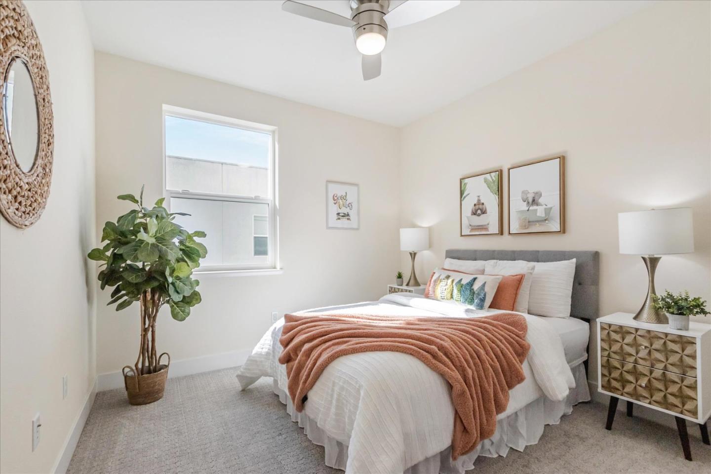 1653 Centre Pointe Drive Milpitas, CA 95035 - Photo 26 of 40 a bedroom with bed and a potted plant