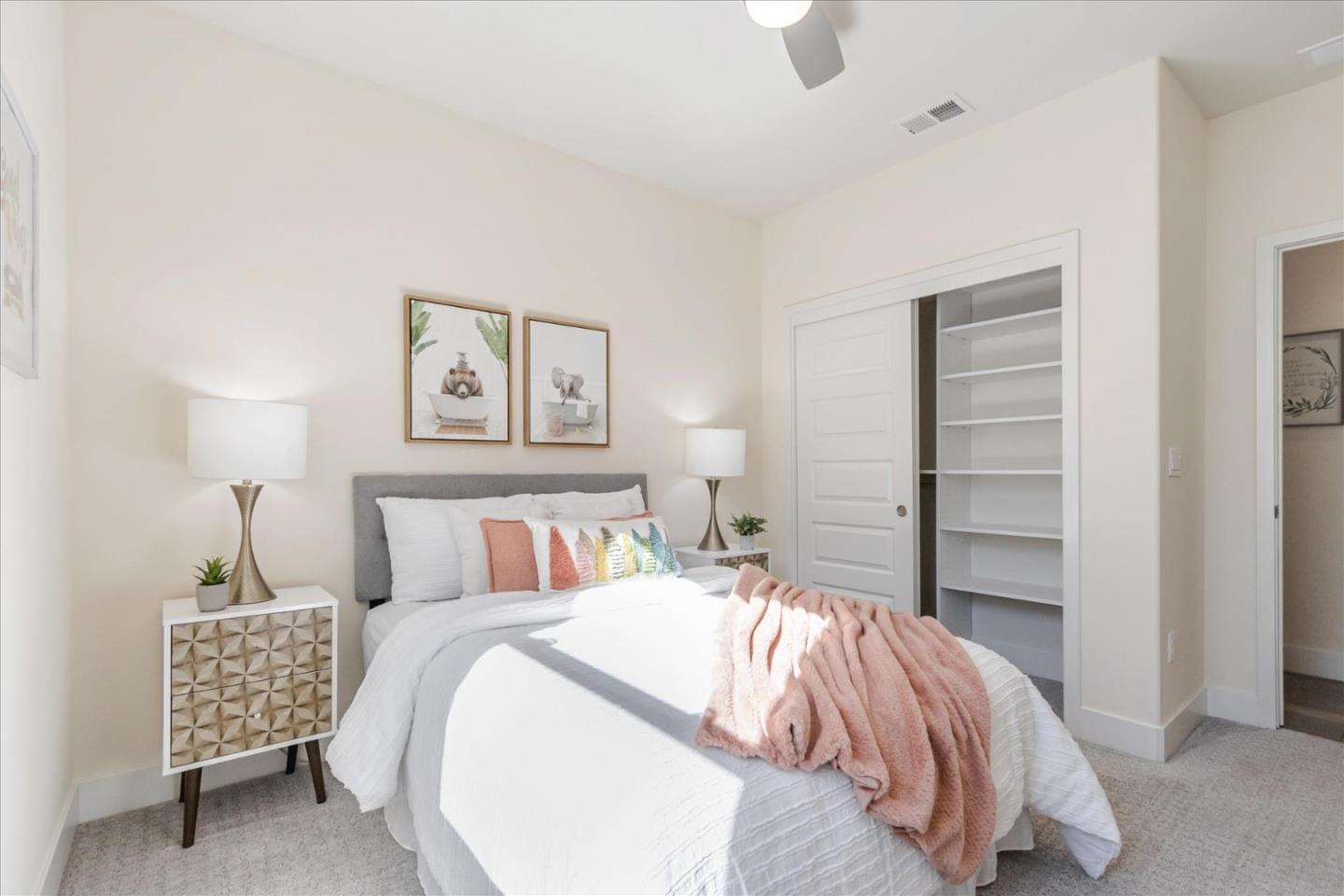 1653 Centre Pointe Drive Milpitas, CA 95035 - Photo 27 of 40 a bedroom with a bed and a lamp