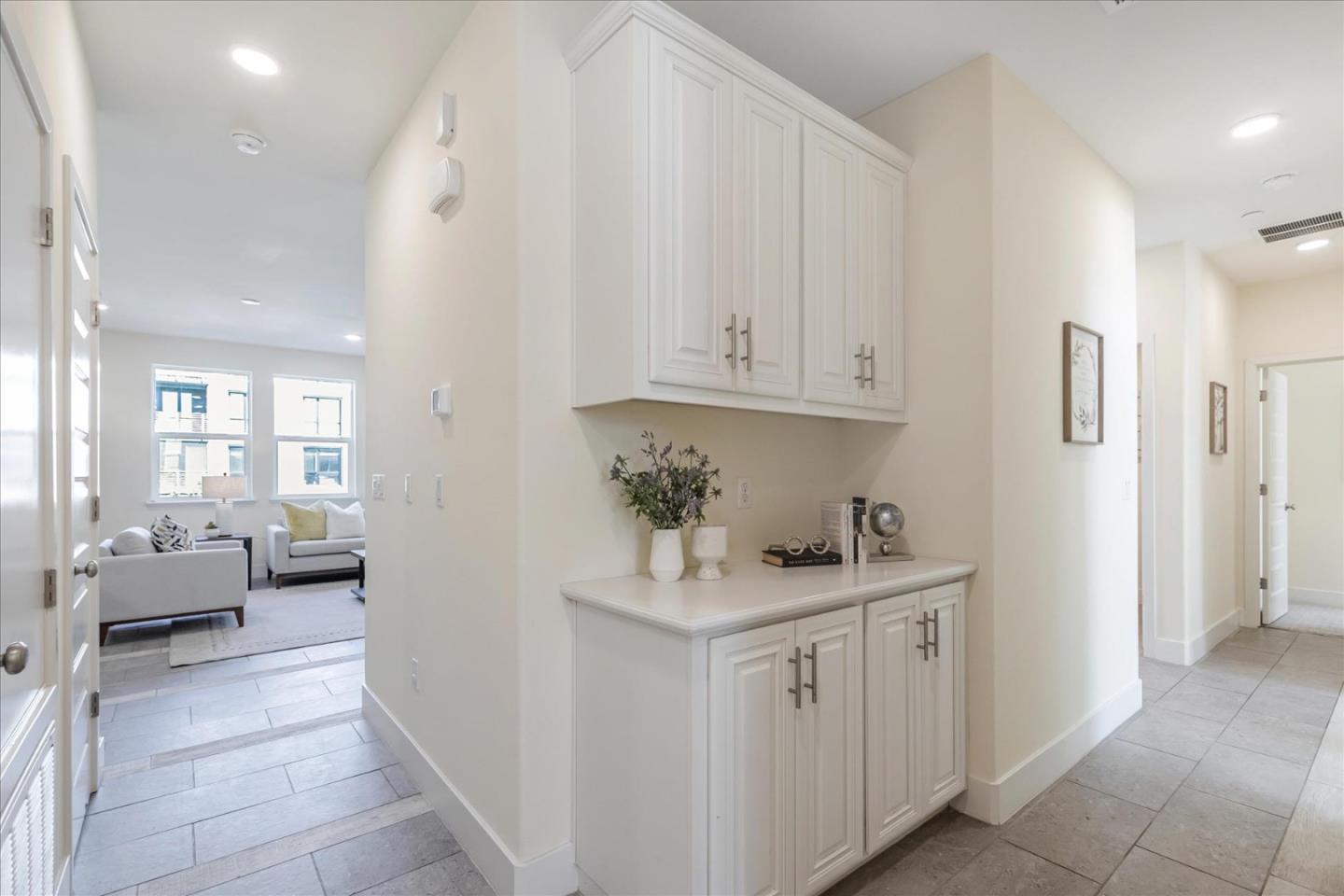 1653 Centre Pointe Drive Milpitas, CA 95035 - Photo 5 of 40 a kitchen with white cabinets and sink