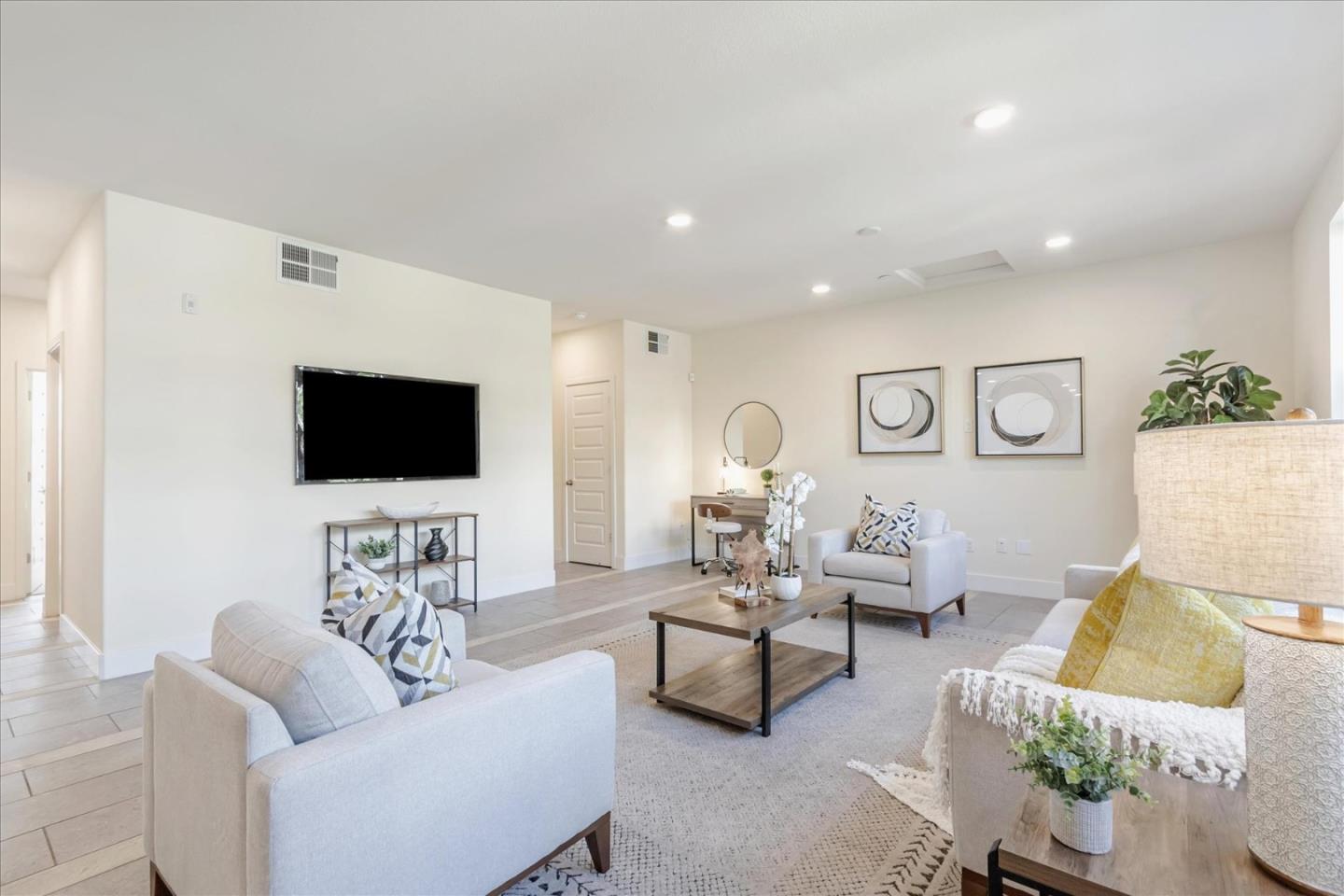 1653 Centre Pointe Drive Milpitas, CA 95035 - Photo 7 of 40 a living room with furniture and a flat screen tv