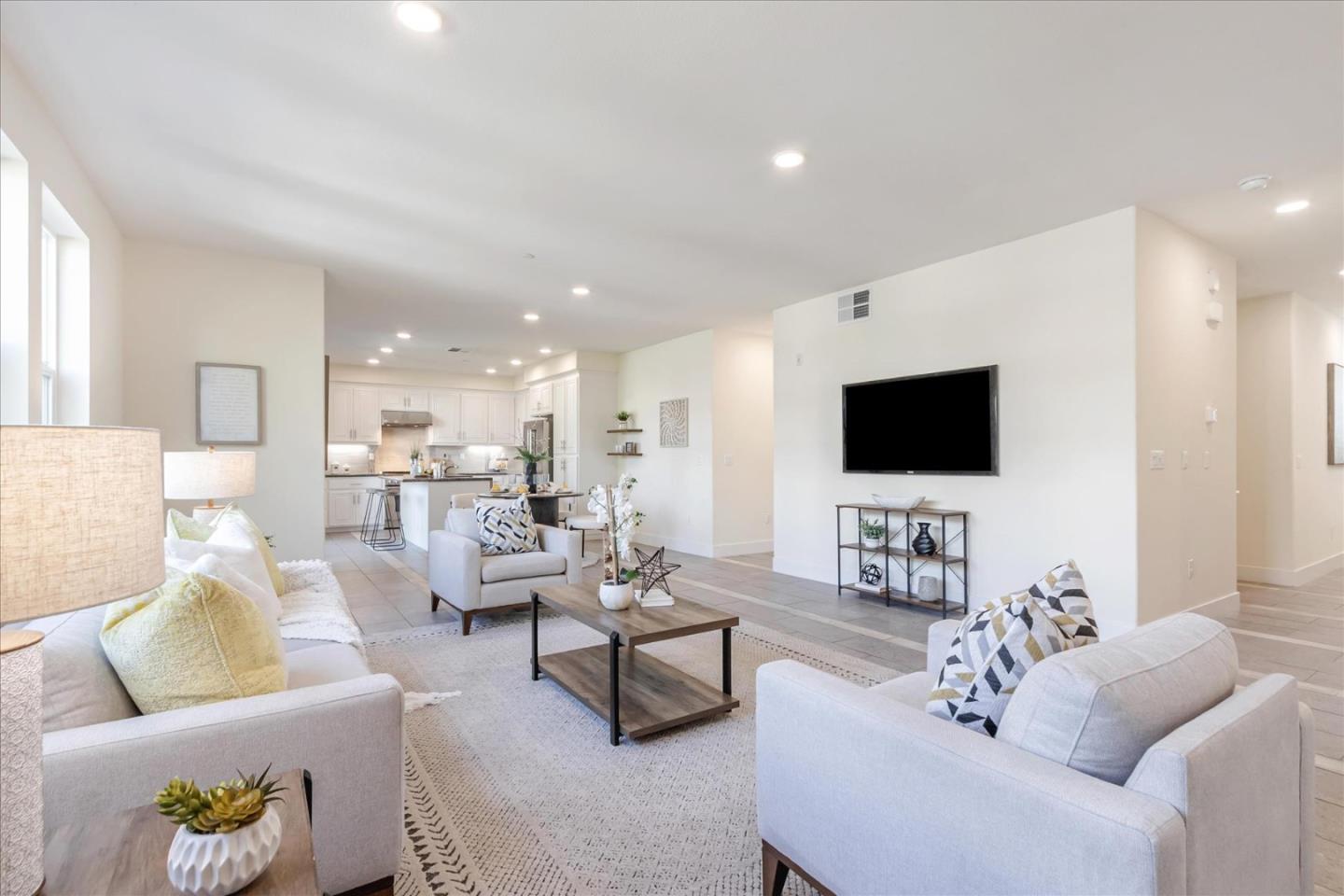 1653 Centre Pointe Drive Milpitas, CA 95035 - Photo 8 of 40 a living room with furniture and a flat screen tv