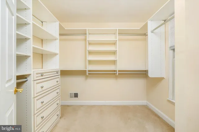 a view of a room with window and stairs