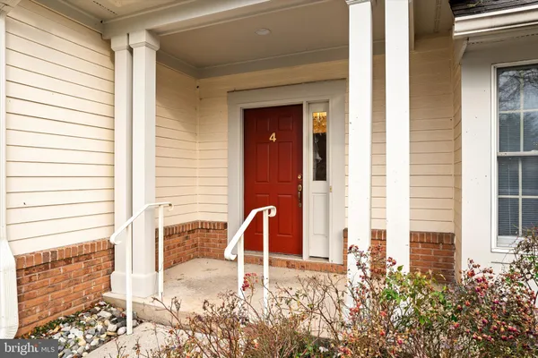 a front view of a house with large windows