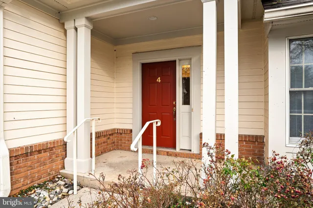 a front view of a house with large windows