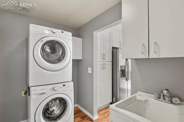 a utility room with sink dryer and washer