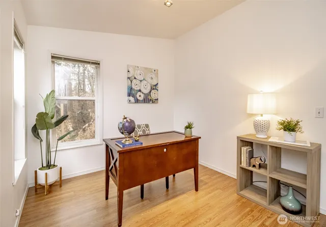 a workspace with furniture and a window