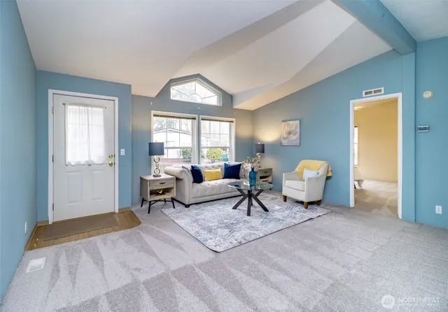 a living room with furniture and a window