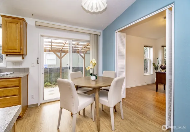 a dining room with furniture window wooden floor