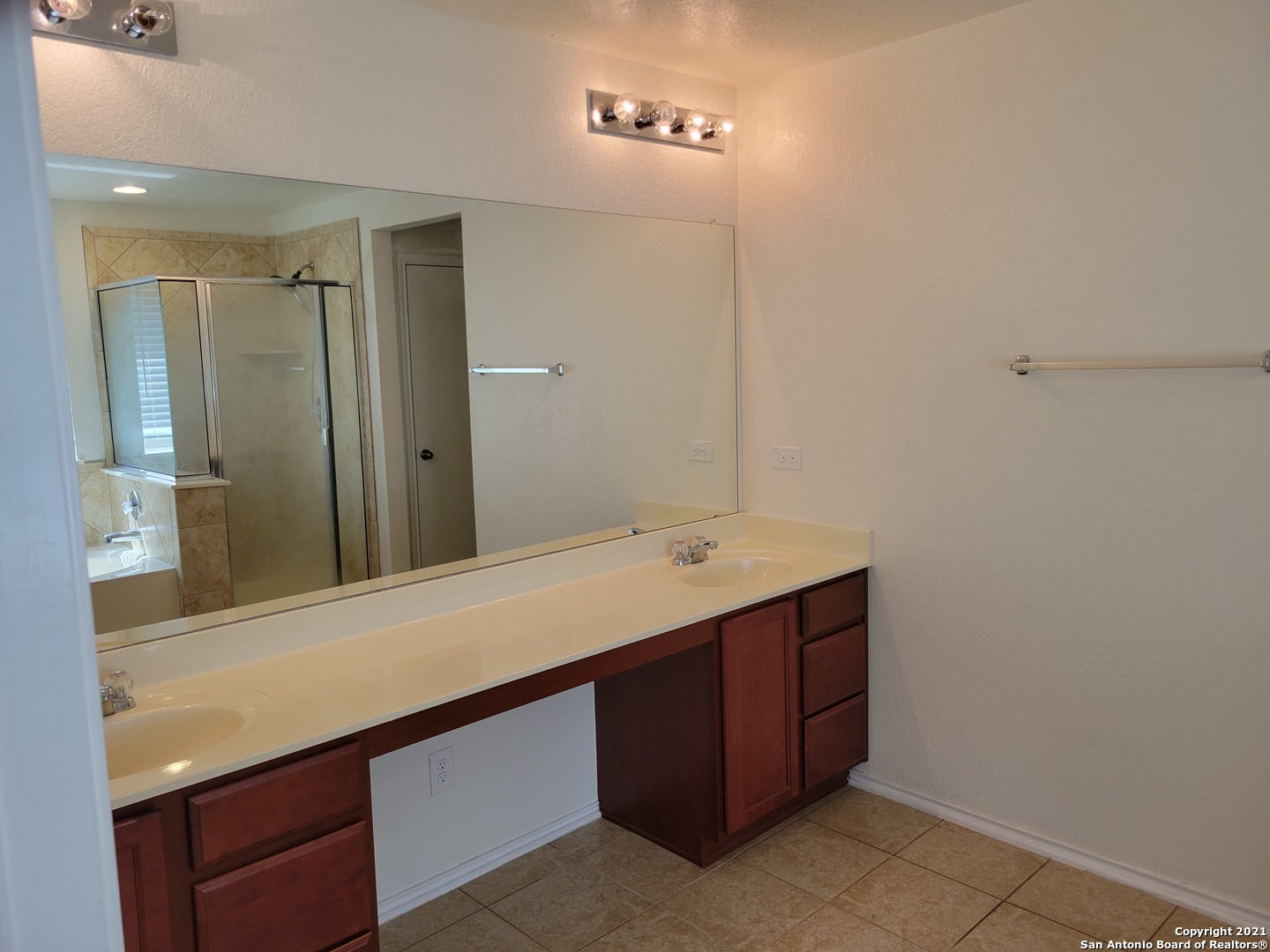 10919 Fox Crest Live Oak, TX 78233 - Photo 16 of 19 a bathroom with a sink and a mirror