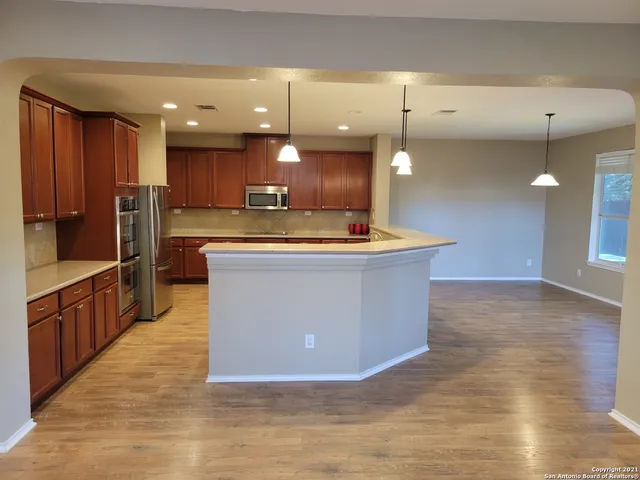 a kitchen with a sink and window