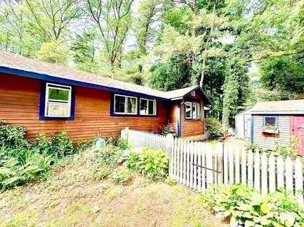 a front view of a house having yard