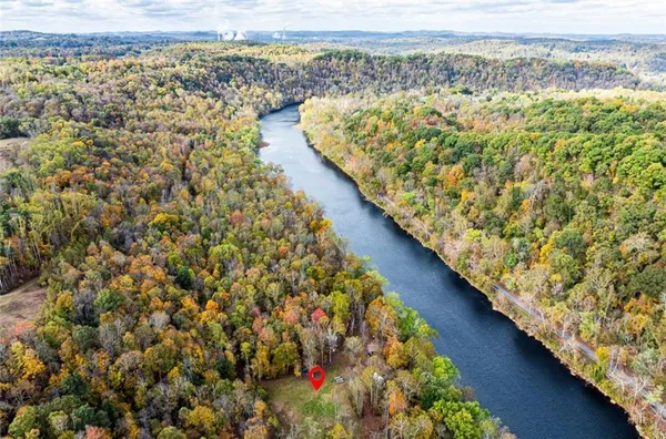 an aerial view of a houses with a yard