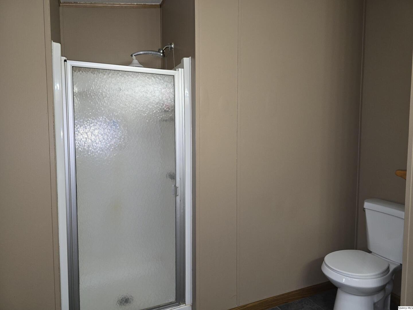 1103 East Main Augusta, IL 62311 - Photo 12 of 27 a bathroom with a granite countertop toilet and a sink