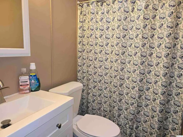 a bathroom with a toilet and a sink