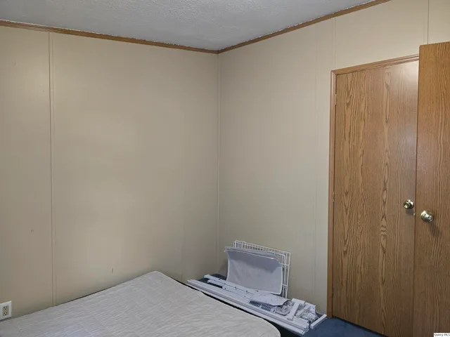 a bedroom with a bed and a cabinets