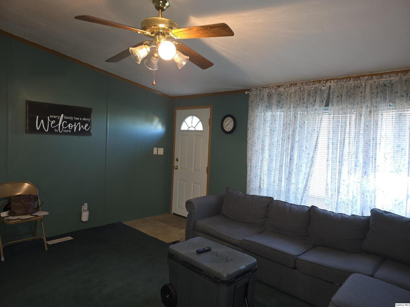 1103 East Main Augusta, IL 62311 - Photo 3 of 27 a living room with furniture and a chandelier