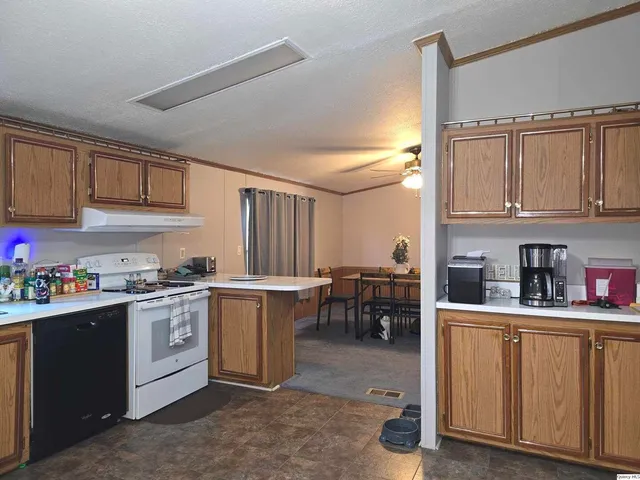 a kitchen with lots of counter top space and appliances