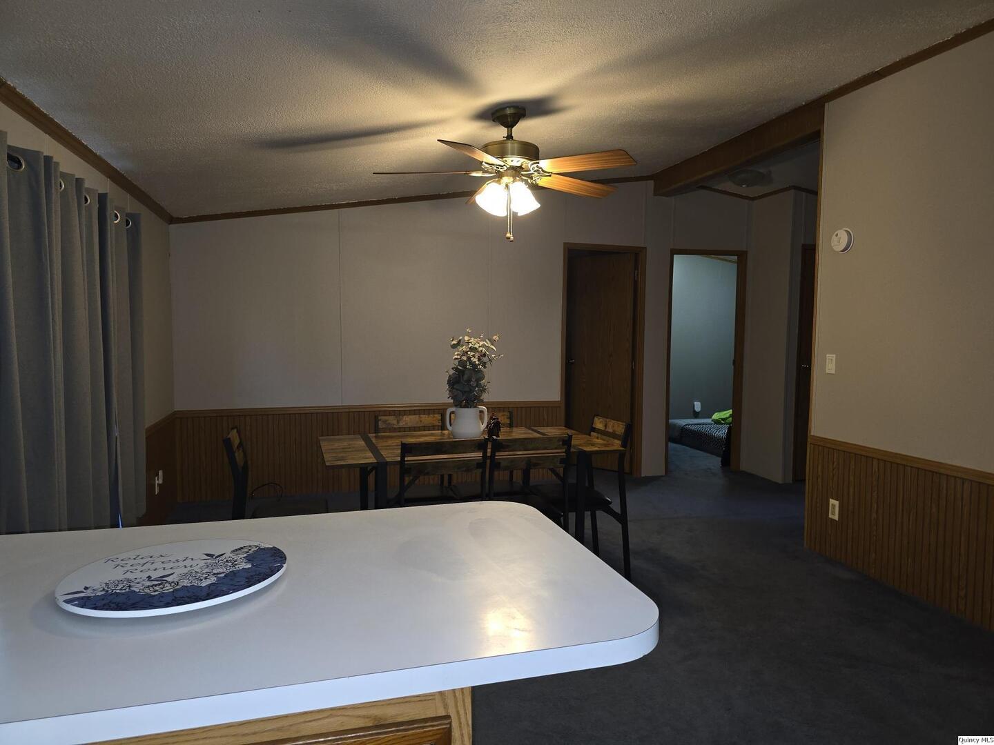 1103 East Main Augusta, IL 62311 - Photo 7 of 27 a dining room with a table and chairs