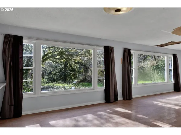 a view of a room that has a large window