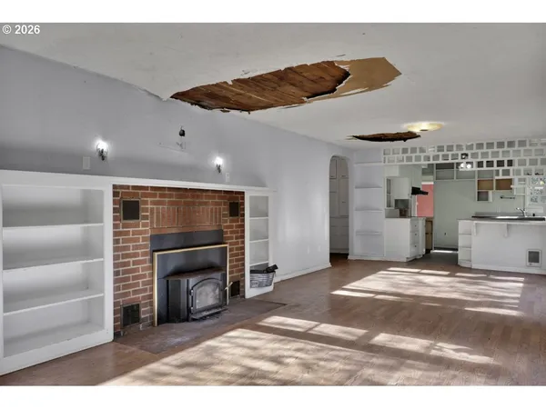 a view of a livingroom with furniture and a fireplace