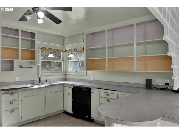 a kitchen with a sink and cabinets