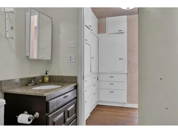 a bathroom with a sink and a mirror