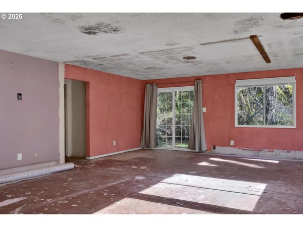 a view of an empty room with a window