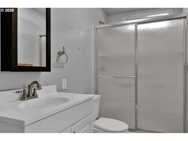 a bathroom with a sink and mirror
