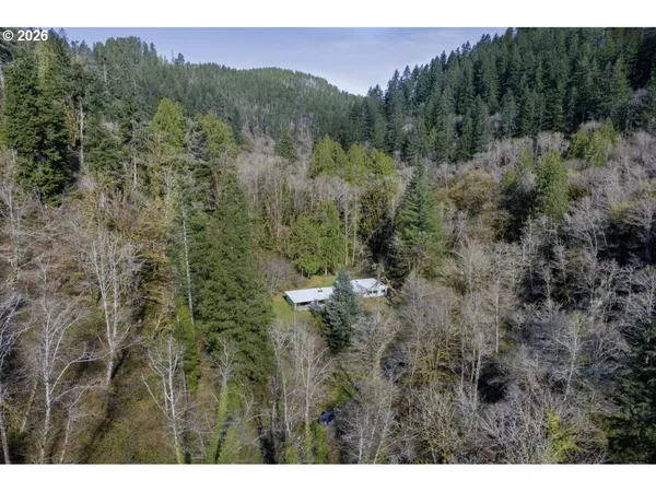 a aerial view of a house with a yard