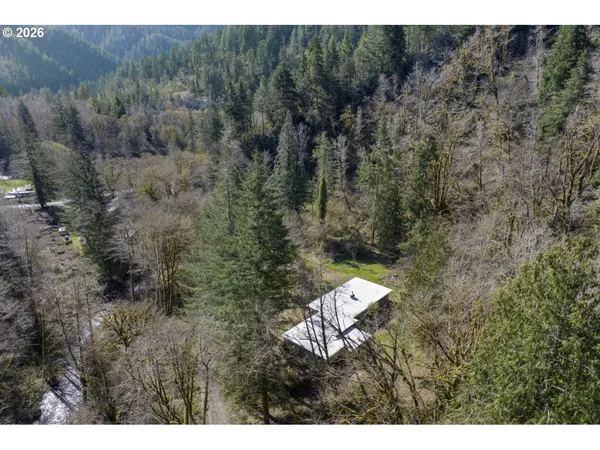 a aerial view of a house with a yard