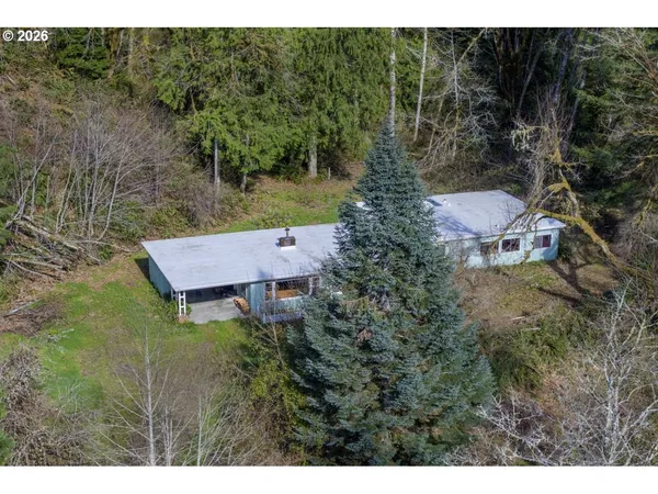 a aerial view of a house with a yard