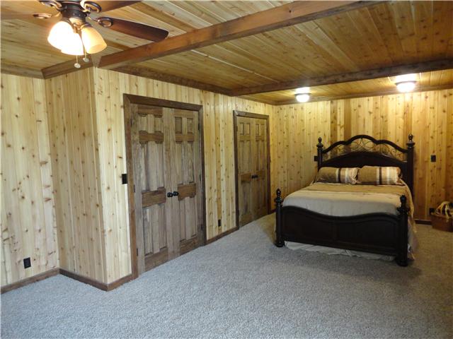 1460 Poplar Ridge Road Chapmansboro, TN 37035 - Photo 15 of 20 The master suite is 22 x 14, has two walk in closets, full updated bath & French doors out to a private deck