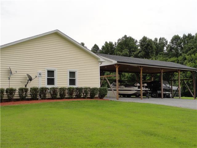 1460 Poplar Ridge Road Chapmansboro, TN 37035 - Photo 4 of 20 side view of the home coming up the driveway