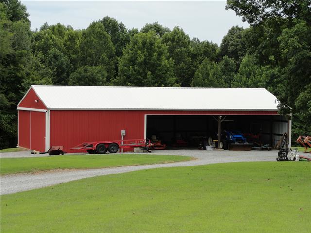 1460 Poplar Ridge Road Chapmansboro, TN 37035 - Photo 5 of 20 The metal barn is insulated & is 30 x 64 with 3 open bays for hay or equipment & the finished side is 30 x 24 & has a big sliding door & 220 amp wiring
